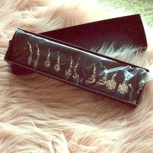 Set of 5 earnings brand new. Never been opened.